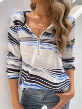 Printed half zip long sleeve top in white, blue, black stripes