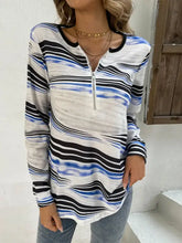 Printed half zip long sleeve top with abstract blue and black stripes