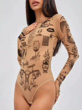 Beige long sleeve bodysuit with intricate black tattoo style illustrations and text for stylish wear