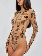Beige long sleeve bodysuit featuring intricate black tattoo style illustrations ideal for stylish layering