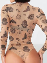 A sheer tan printed mock neck long sleeve bodysuit featuring black mystical symbols and the phrase great things