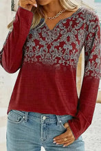 Women’s printed notched long sleeve red blouse with V-neck floral pattern and jeans