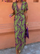 Printed plunge short sleeve midi dress with green purple floral print and ruffled sleeves
