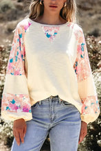 Printed round neck balloon sleeve sweatshirt in cream floral print