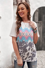 Printed round neck tunic tee with tribal cowhide print and regular sleeve length