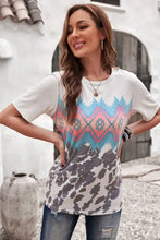 Womens white printed round neck tunic tee with colorful geometric print