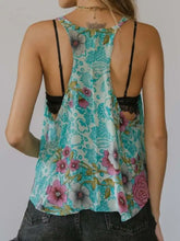 Turquoise floral print scoop neck tank with black lace trim and thin straps featuring a printed scoop neck design
