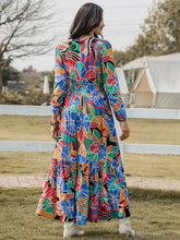 Printed smocked tie balloon sleeve maxi dress with abstract floral pattern