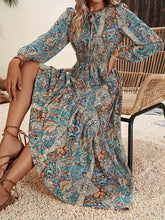 Printed tie neck long sleeve maxi dress in vibrant paisley print