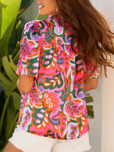 Vibrant pink green and orange floral printed tie neck short sleeve blouse with high neckline for stylish wear