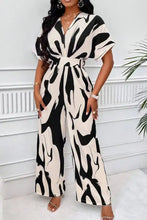 Zwart- en crèmekleurige jumpsuit met brede pijpen en zebraprint, V-hals en ceintuur