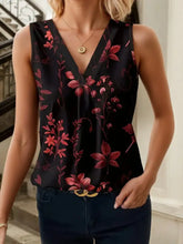 Black printed v neck tank top with vibrant red floral pattern made of smooth satin-like fabric