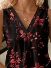 Black sleeveless printed v neck tank top with vibrant red floral pattern featuring a classic neck tank design