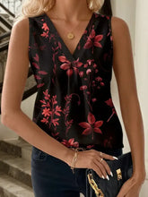 Black printed v neck sleeveless tank top with vibrant red floral pattern on lightweight flowing fabric