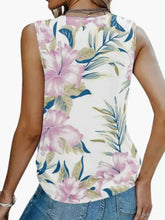 Printed v-neck tank sleeveless top with vibrant tropical pink hibiscus flowers and blue green leaves on white background