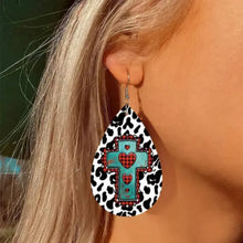 Cow print teardrop earring with turquoise cross, red plaid hearts, iron hook