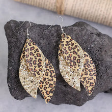 Leopard leaf earrings in PU leather with glitter dangle design