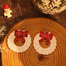 White leather sequin wreath shape earrings with red glitter bows
