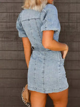 Light blue mini denim dress with short puff sleeves and belted waist in a button up style