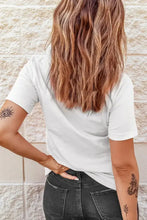 Women’s pumpkin graphic short sleeve white t-shirt with black jeans