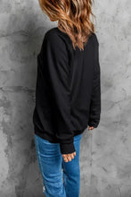 Pumpkin round neck long sleeve sweatshirt in black with jeans