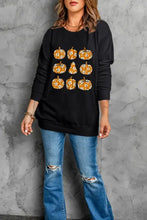 Black pumpkin print long sleeve sweatshirt with floral pattern
