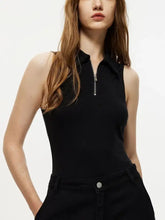 Black sleeveless quarter zip collared bodysuit with zippered front and fitted design for versatile styling