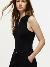 Black quarter zip collared sleeveless bodysuit made of smooth fabric with front zipper detail