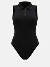 Black sleeveless one-piece swimsuit with quarter zip collared neck and front zipper for stylish swimwear look