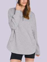 Light grey quarter zip long sleeve hoodie with side slits and buttons