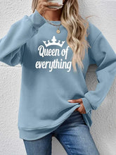 Light blue long-sleeve round neck sweatshirt with white crown and Queen of Everything text
