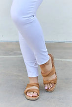 Person in white capri pants wearing Qupid Summertime Fine strap twist sandals with light pink toenails