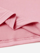 Close-up of pink rabbit round neck short sleeve T-shirt fabric with stitching and folds