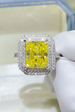 Radiant cut yellow diamond double halo ring in sterling silver