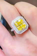 Radiant cut yellow diamond ring in sterling silver with double halo