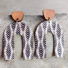 Rainbow drop earrings in cork leather with chevron pattern on white background