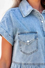 Light-wash denim mini dress with raw hem featuring short sleeves collar and buttoned chest pocket