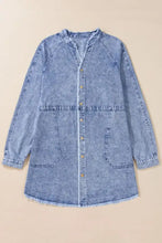 A light blue long sleeve denim dress with raw hem, button-front closure, and raglan sleeves in denim fabric