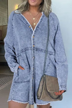 Light blue long sleeve denim dress with raw hem button down design and white faux fur trimmed v-neckline