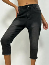 Black denim raw hem capris jeans with a high waist and frayed hems for casual wear