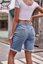 Light-wash raw hem denim shorts with frayed hem and pockets