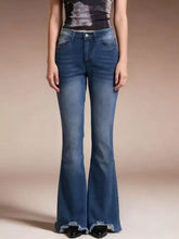 Blue denim raw hem high-waisted flare jeans with faded wash and frayed hem for a stylish casual look