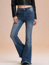 Blue denim raw hem high-waisted flare jeans with frayed hems showcasing trendy flare jeans style
