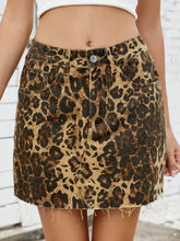 Leopard denim skirt with raw hem detail in a mini length made of frayed denim material