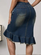 Dark blue raw hem mermaid denim skirt showing back pockets and flared frayed hem detail