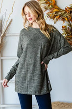 Woman modeling Reborn J Button round neck long sleeve T-shirt in olive green