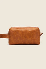 Tan leather makeup bag with zipper, handle, brown and yellow tones