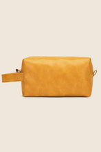 Rectangular yellow leather makeup bag with side handle