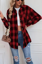 Red and black plaid flannel shirt with button-down closure and sleeve length