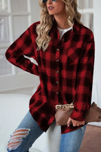 Red and black plaid flannel shirt with button-down closure and sleeve length